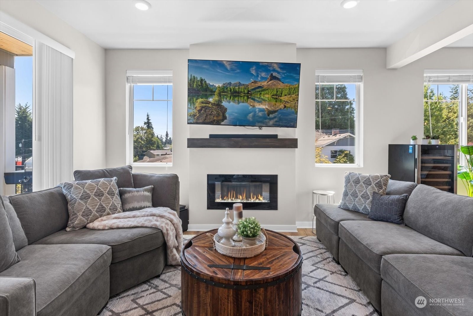 22929 80th Place West, Unit C Edmonds, WA 98026 - Photo 13 of 36 a living room with furniture a fireplace and a large window
