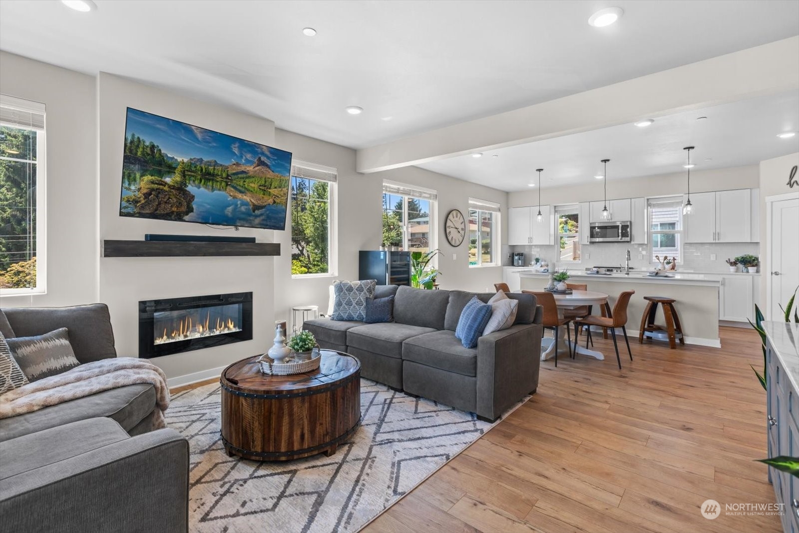 22929 80th Place West, Unit C Edmonds, WA 98026 - Photo 14 of 36 a living room with furniture a fireplace and a table