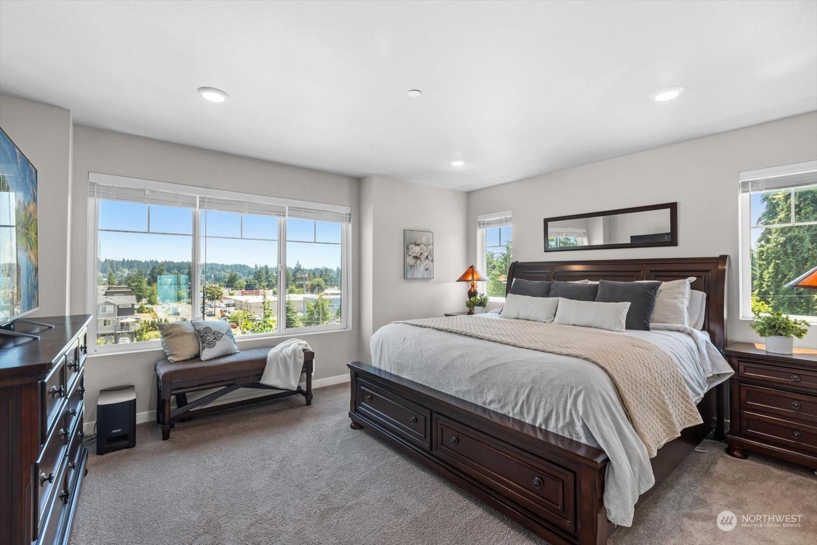 22929 80th Place West, Unit C Edmonds, WA 98026 - Photo 17 of 36 a bedroom with a bed couch and a large window