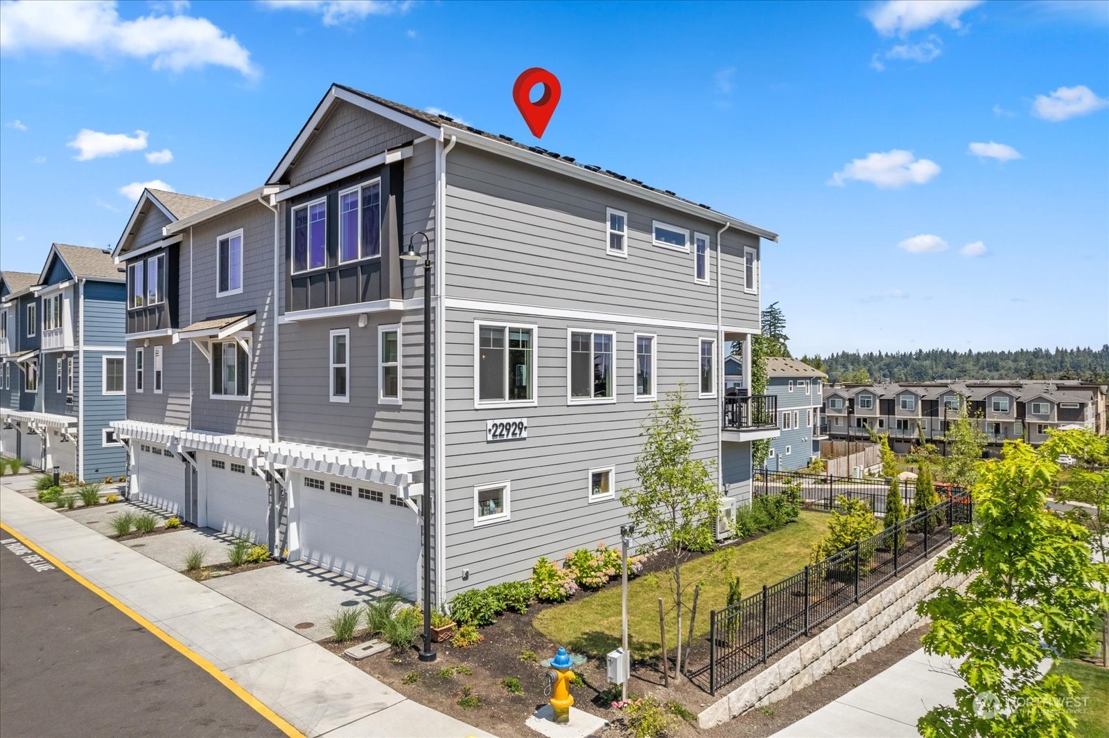 22929 80th Place West, Unit C Edmonds, WA 98026 - Photo 26 of 36 a front view of a house with a street