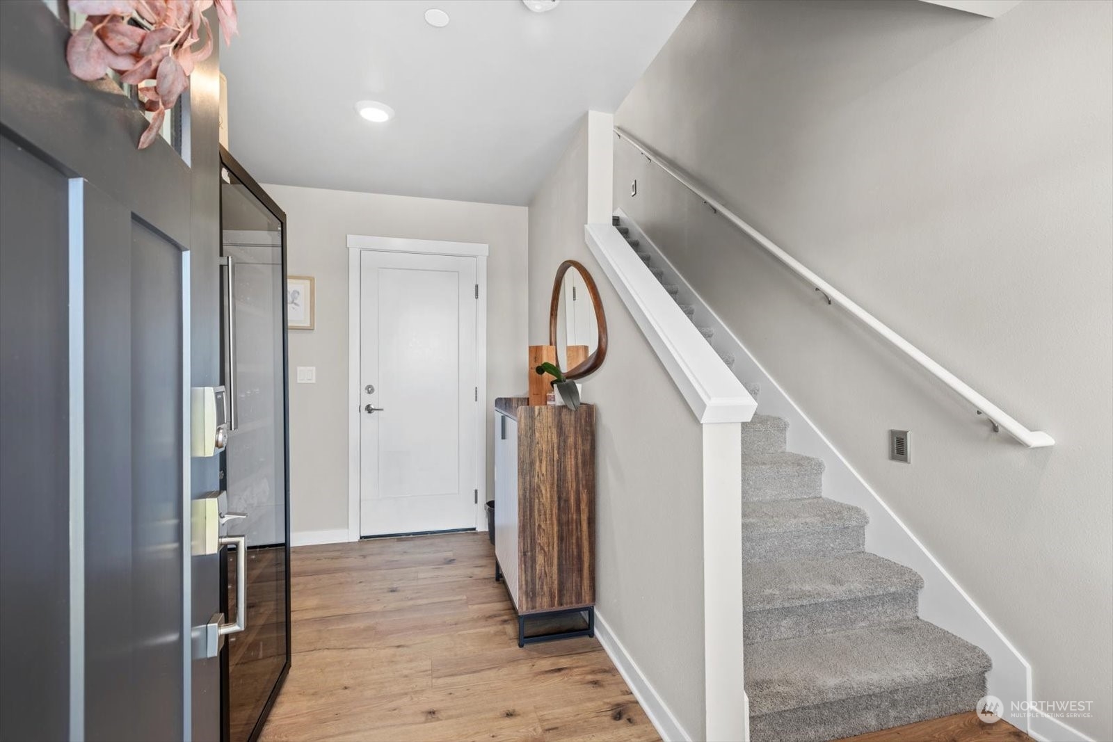 22929 80th Place West, Unit C Edmonds, WA 98026 - Photo 4 of 36 a view of a hallway with wooden floor and staircase