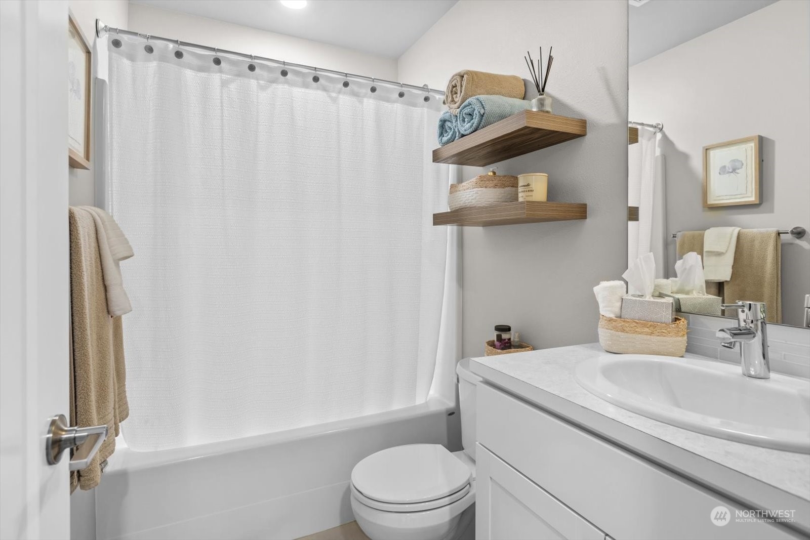 22929 80th Place West, Unit C Edmonds, WA 98026 - Photo 6 of 36 a bathroom with a sink a toilet and shower
