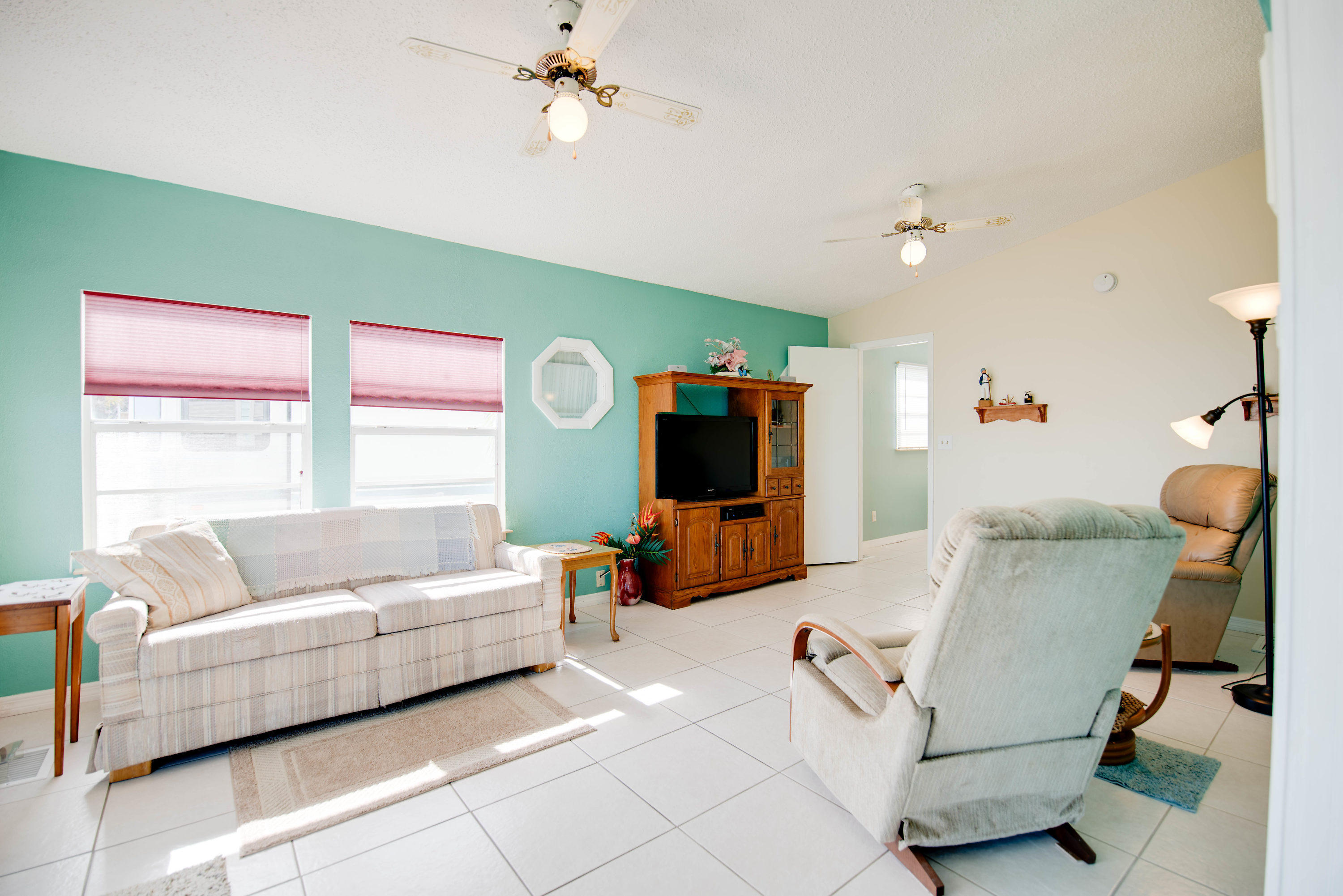 55 Boca Chica Road, Unit 430 Key West, FL 33040 - Photo 11 of 34 a living room with furniture and a flat screen tv