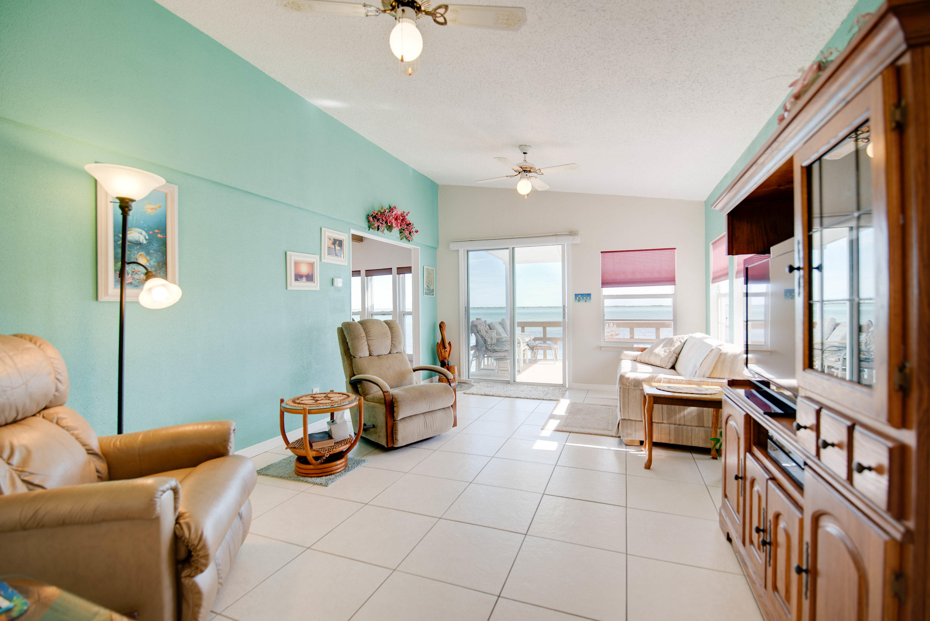 55 Boca Chica Road, Unit 430 Key West, FL 33040 - Photo 12 of 34 a living room with furniture and a flat screen tv