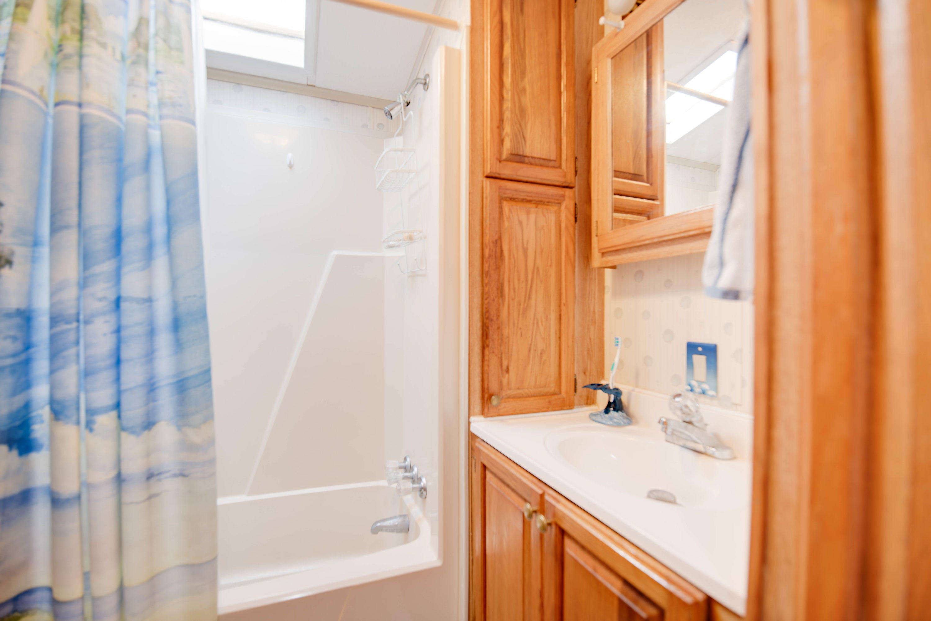 55 Boca Chica Road, Unit 430 Key West, FL 33040 - Photo 15 of 34 a bathroom with a granite countertop sink and a mirror