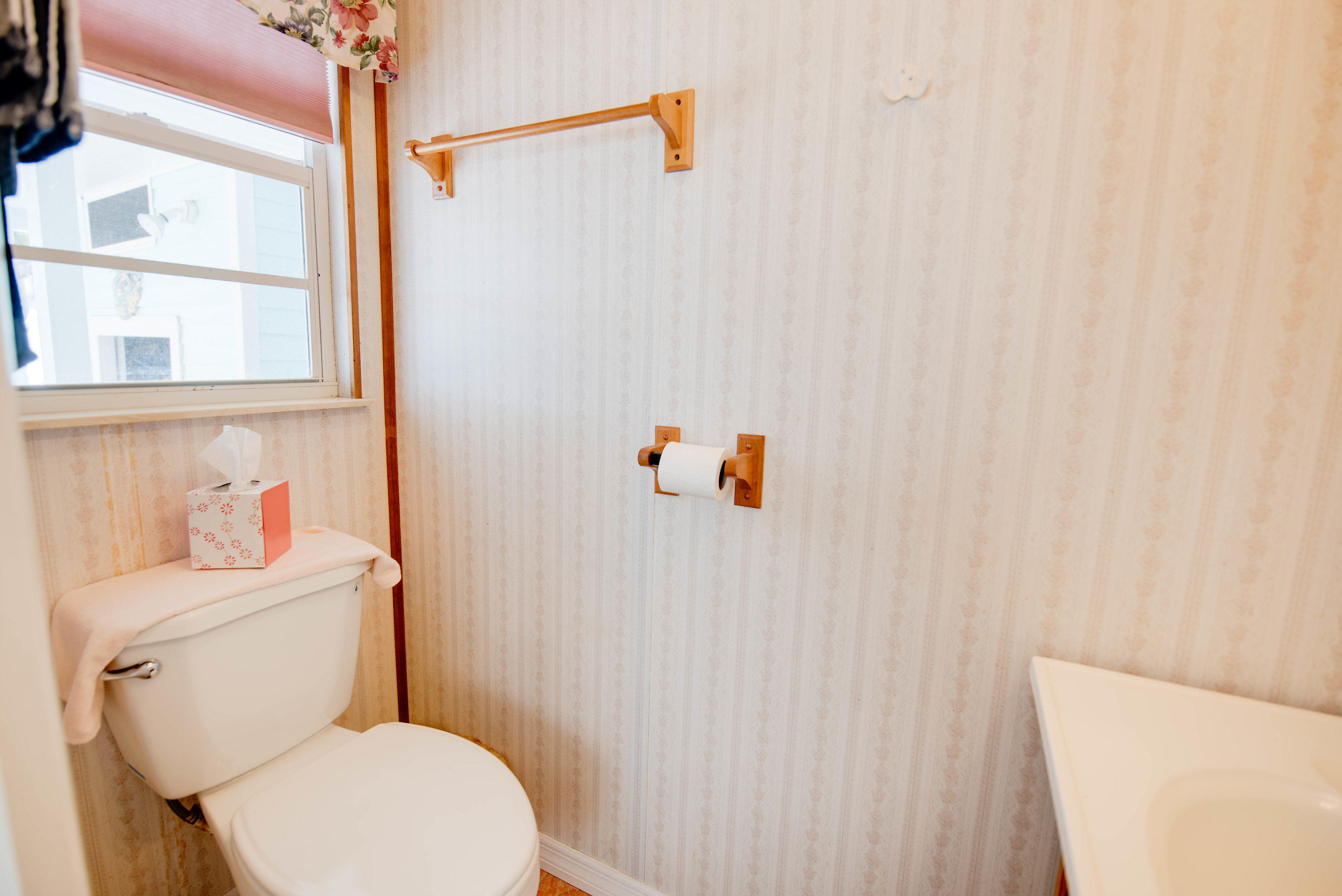 55 Boca Chica Road, Unit 430 Key West, FL 33040 - Photo 16 of 34 a white toilet sitting next to a bathroom sink