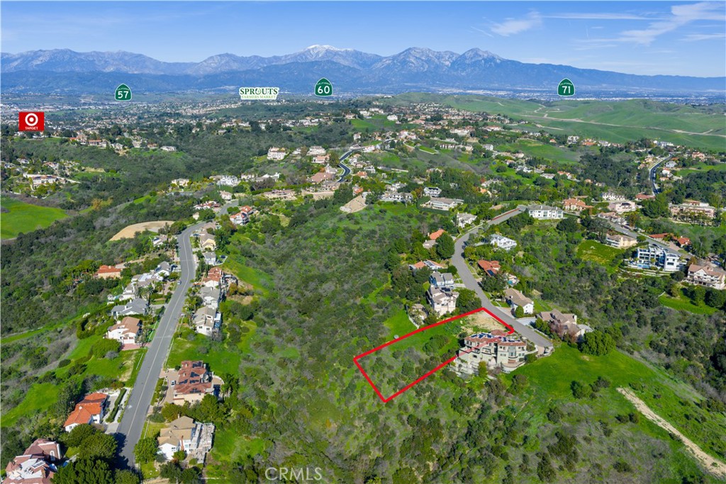 2691 Shady Ridge Lane Diamond Bar, CA 91765 - Photo 2 of 4 a view of a lush green hillside and houses