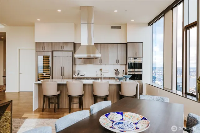 a large kitchen with a table and chairs
