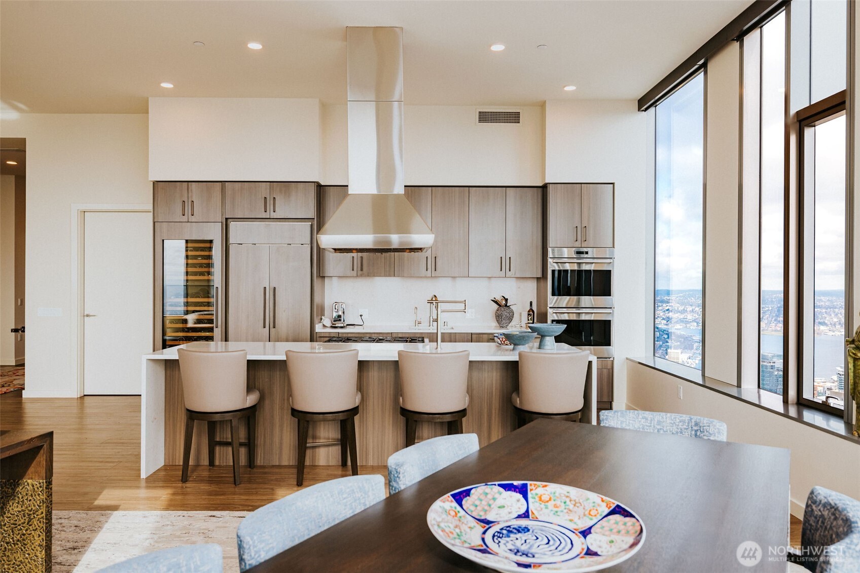 1340 4th Avenue, Unit 5803 Seattle, WA 98101 - Photo 11 of 39 a large kitchen with a table and chairs