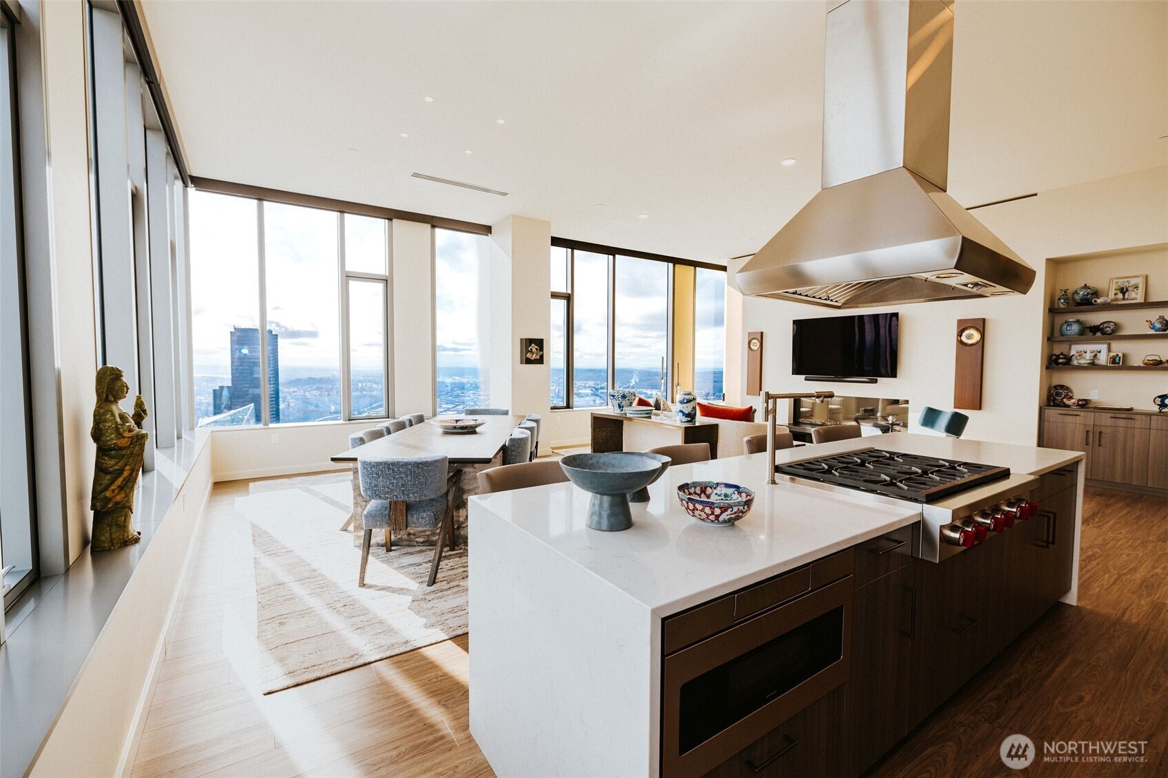 1340 4th Avenue, Unit 5803 Seattle, WA 98101 - Photo 15 of 39 a view of open kitchen with dining table and chairs