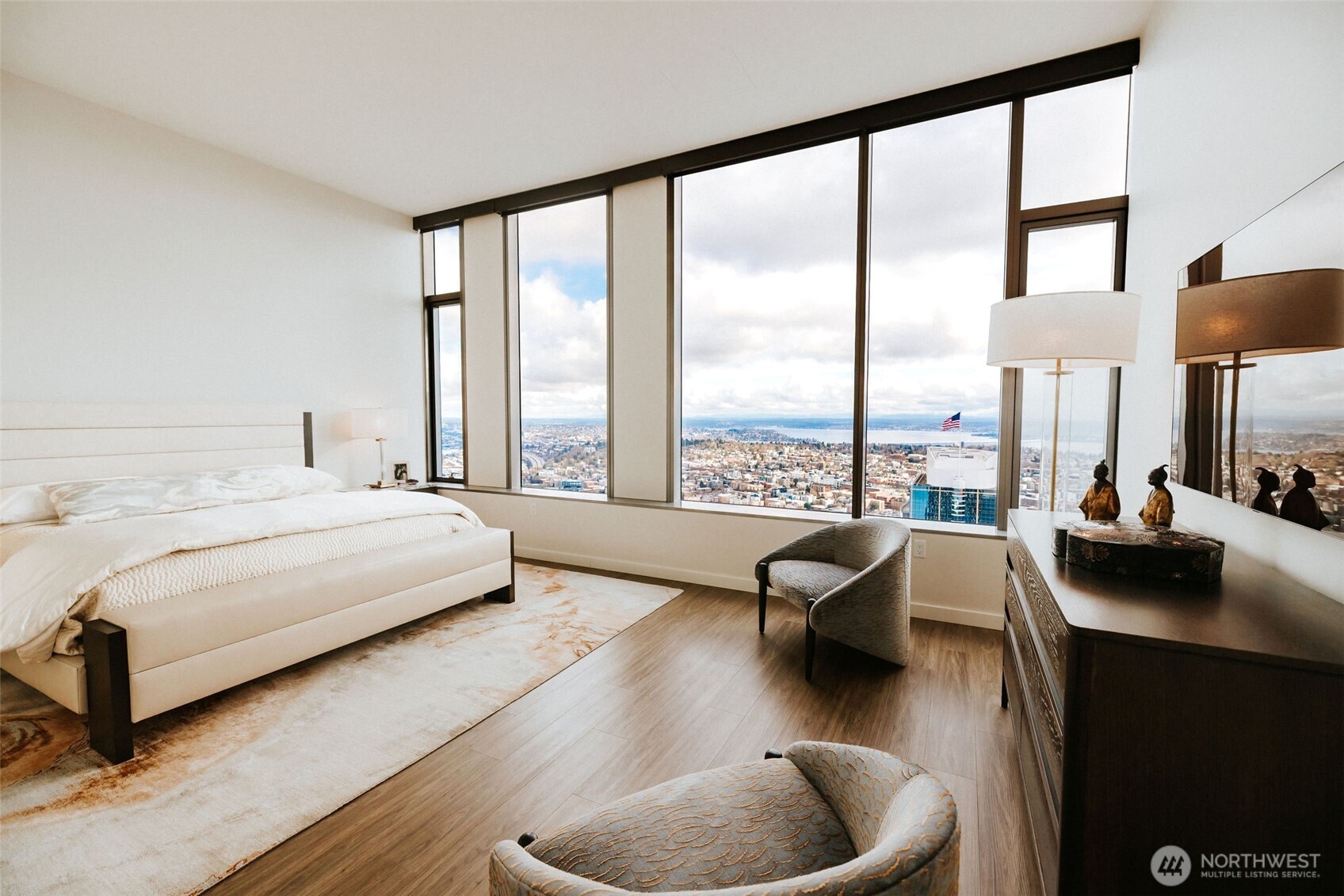 1340 4th Avenue, Unit 5803 Seattle, WA 98101 - Photo 19 of 39 a bedroom with furniture and a large window
