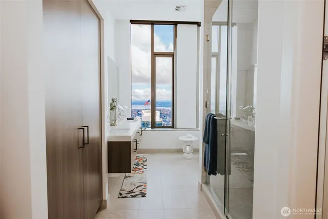 a bathroom with a tub and a sink
