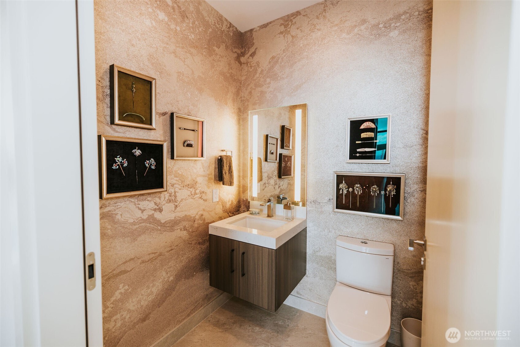 1340 4th Avenue, Unit 5803 Seattle, WA 98101 - Photo 23 of 39 a bathroom with a toilet sink and mirror