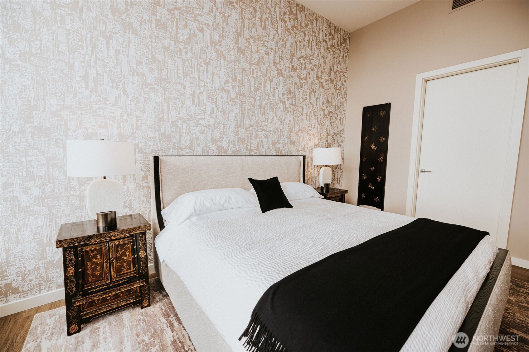 1340 4th Avenue, Unit 5803 Seattle, WA 98101 - Photo 26 of 39 a bedroom with a bed and a tv on a dresser