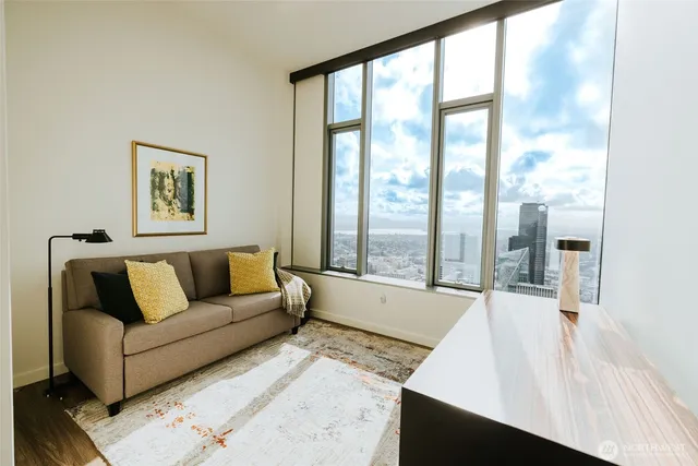 a living room with furniture and a large window