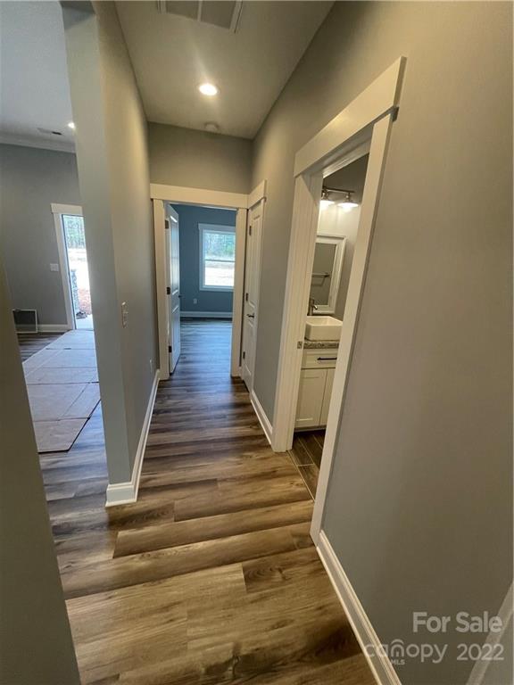 580 Crescent Road Salisbury, NC 28146 - Photo 17 of 38 a view of a hallway with wooden floor and staircase