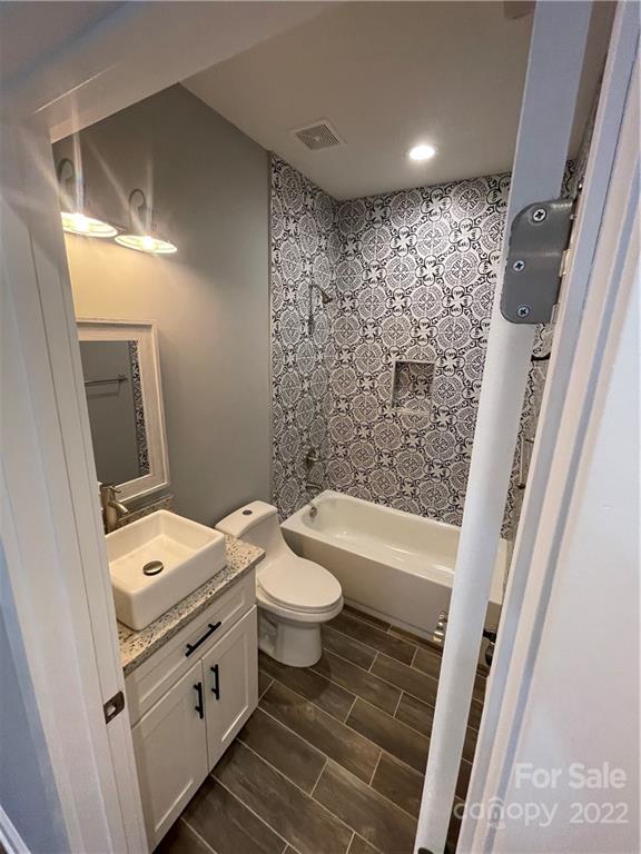 580 Crescent Road Salisbury, NC 28146 - Photo 22 of 38 a bathroom with a toilet a sink and a bathtub
