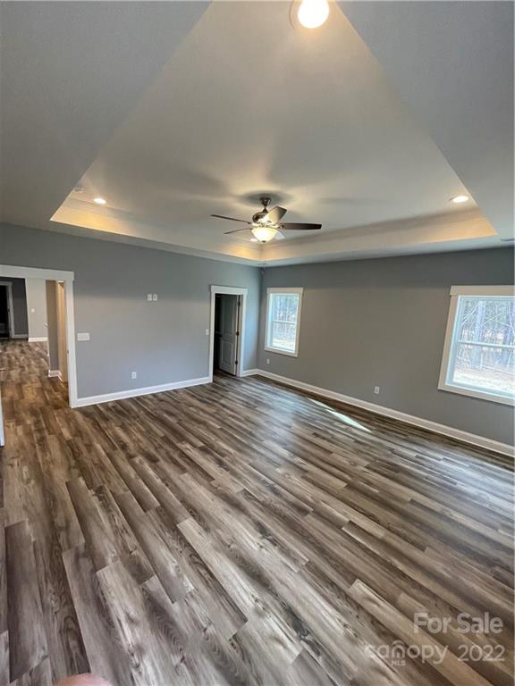 580 Crescent Road Salisbury, NC 28146 - Photo 29 of 38 a view of a livingroom with a ceiling fan and wooden floor