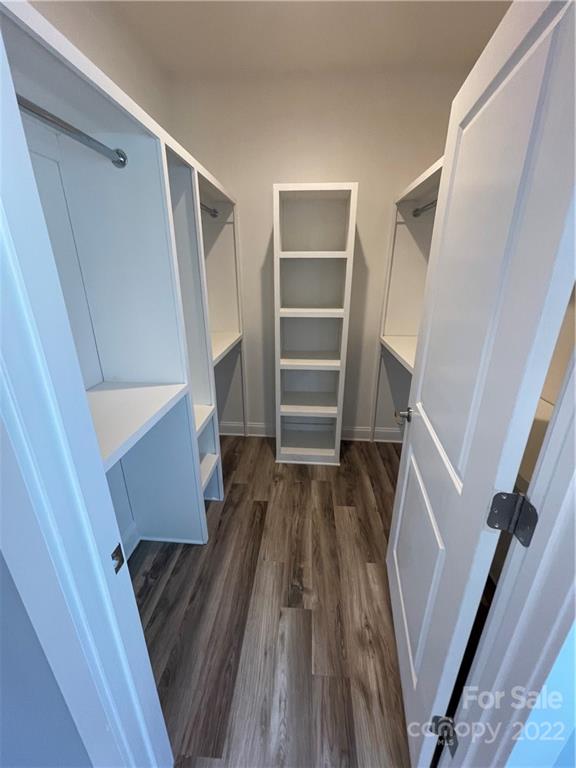 580 Crescent Road Salisbury, NC 28146 - Photo 30 of 38 a view of walk in closet with wooden floor and stairs
