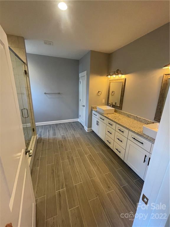 580 Crescent Road Salisbury, NC 28146 - Photo 31 of 38 a bathroom with a sink and mirror