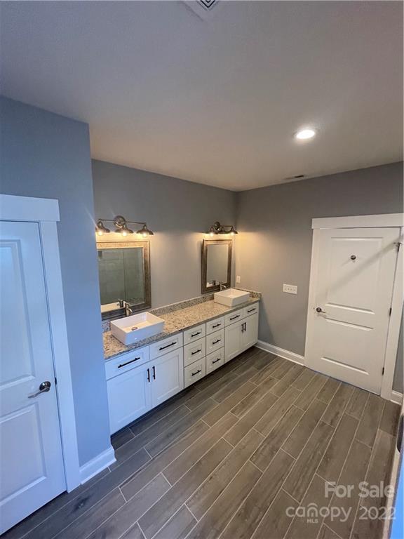 580 Crescent Road Salisbury, NC 28146 - Photo 32 of 38 a kitchen with stainless steel appliances wooden floors and view living room