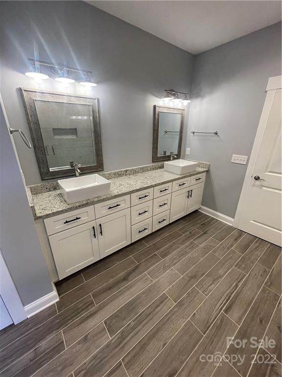 580 Crescent Road Salisbury, NC 28146 - Photo 38 of 38 a bathroom with a double vanity sink and mirror
