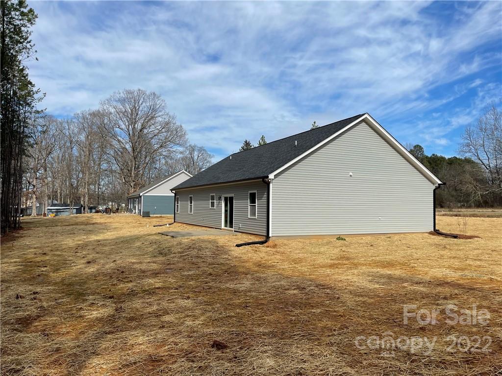 580 Crescent Road Salisbury, NC 28146 - Photo 4 of 38 a backyard of house with large trees