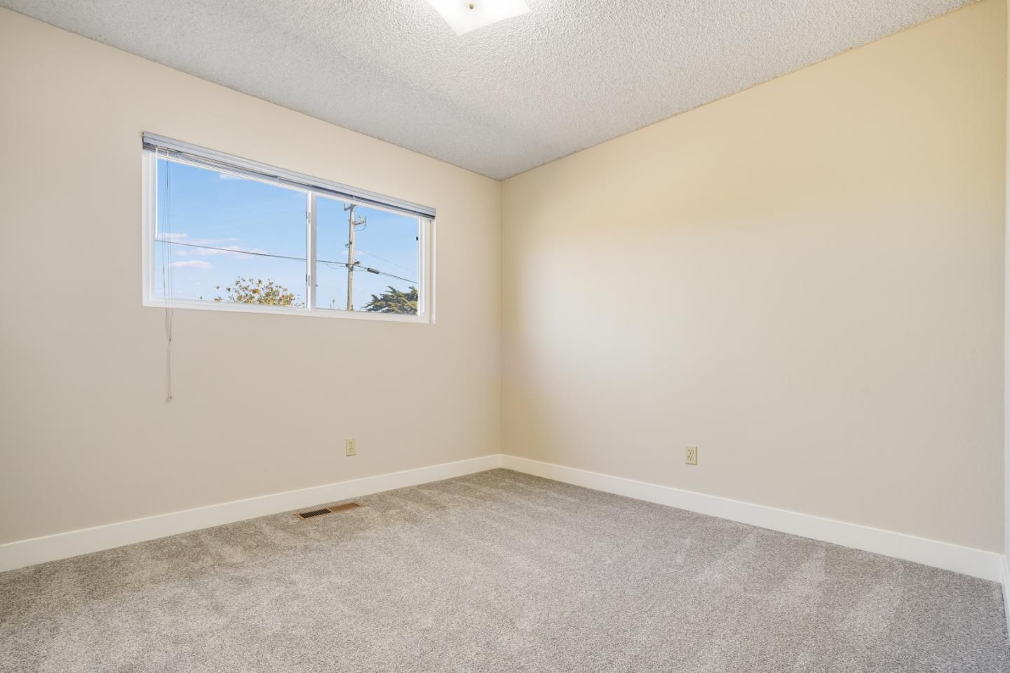 160 Hilo Avenue Marina, CA 93933 - Photo 16 of 23 an empty room with a window