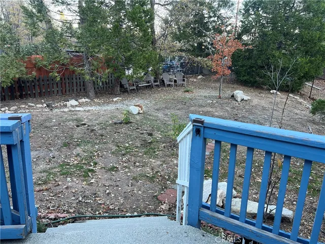 a view of a wooden deck with a trees
