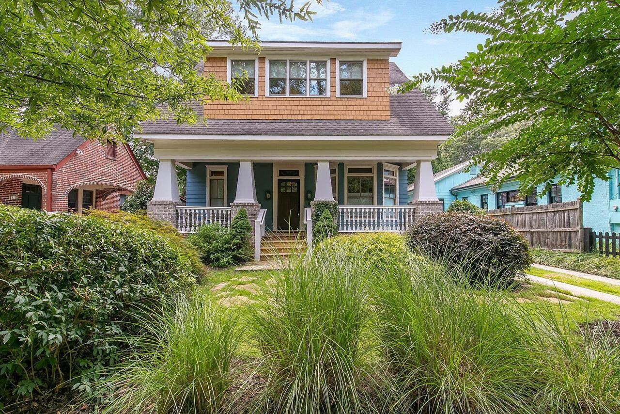front view of a house with a yard