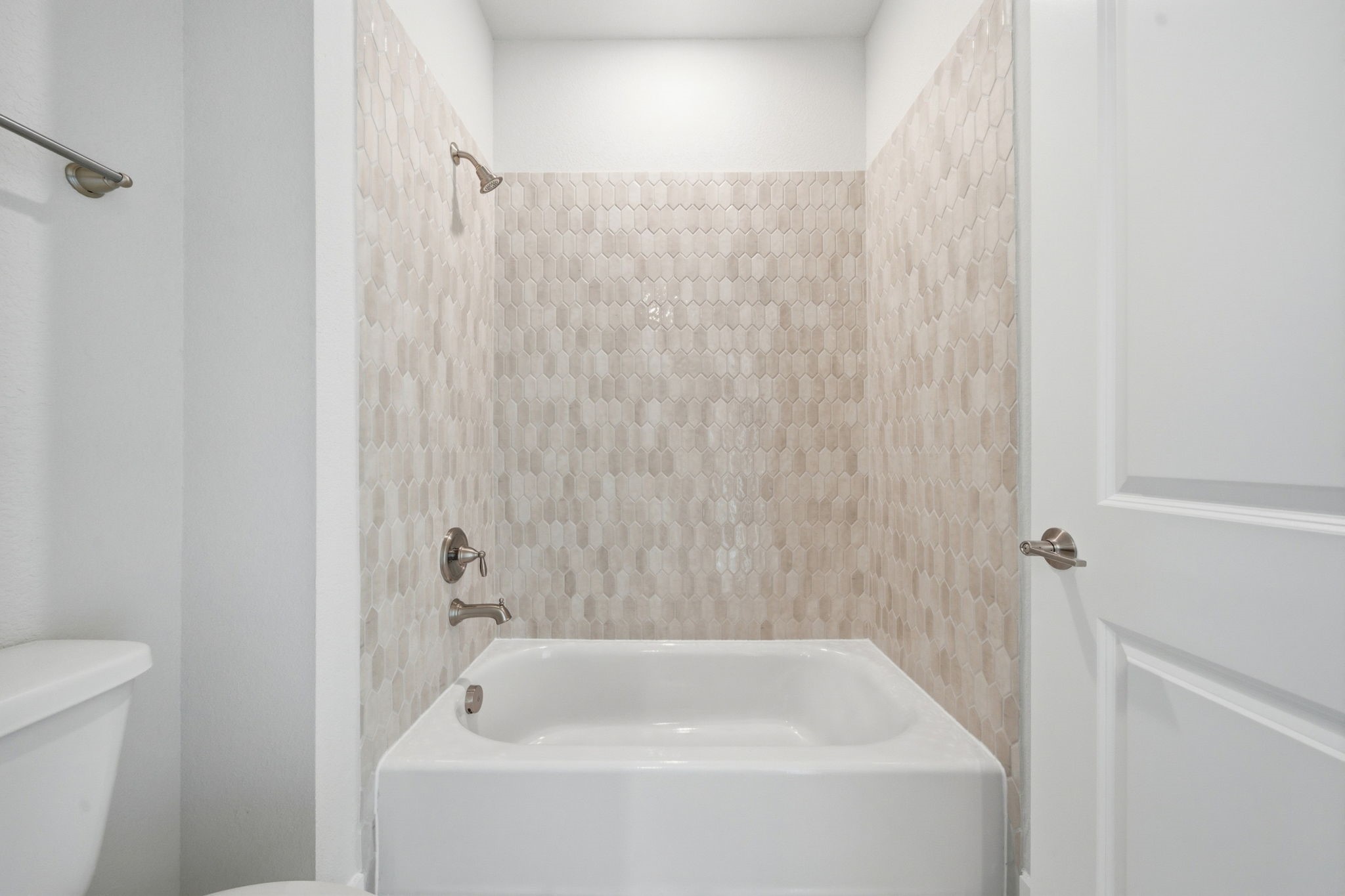 10026 Larkin Cove Willis, TX 77318 - Photo 31 of 46 a bathroom with a bathtub
