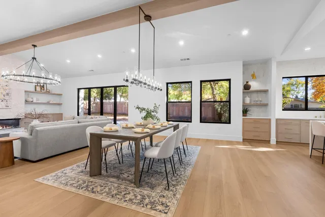 a large kitchen with a table and chairs