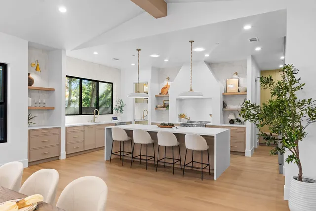 a kitchen with a sink and a stove