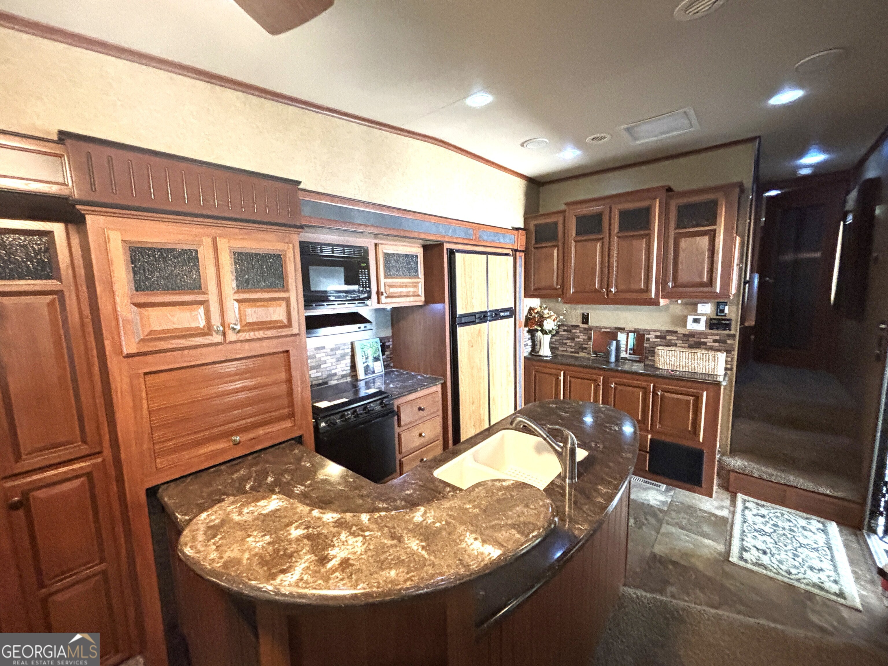 101 Bridge Loop Drive Cleveland, GA 30528 - Photo 21 of 93 a kitchen with refrigerator and stove