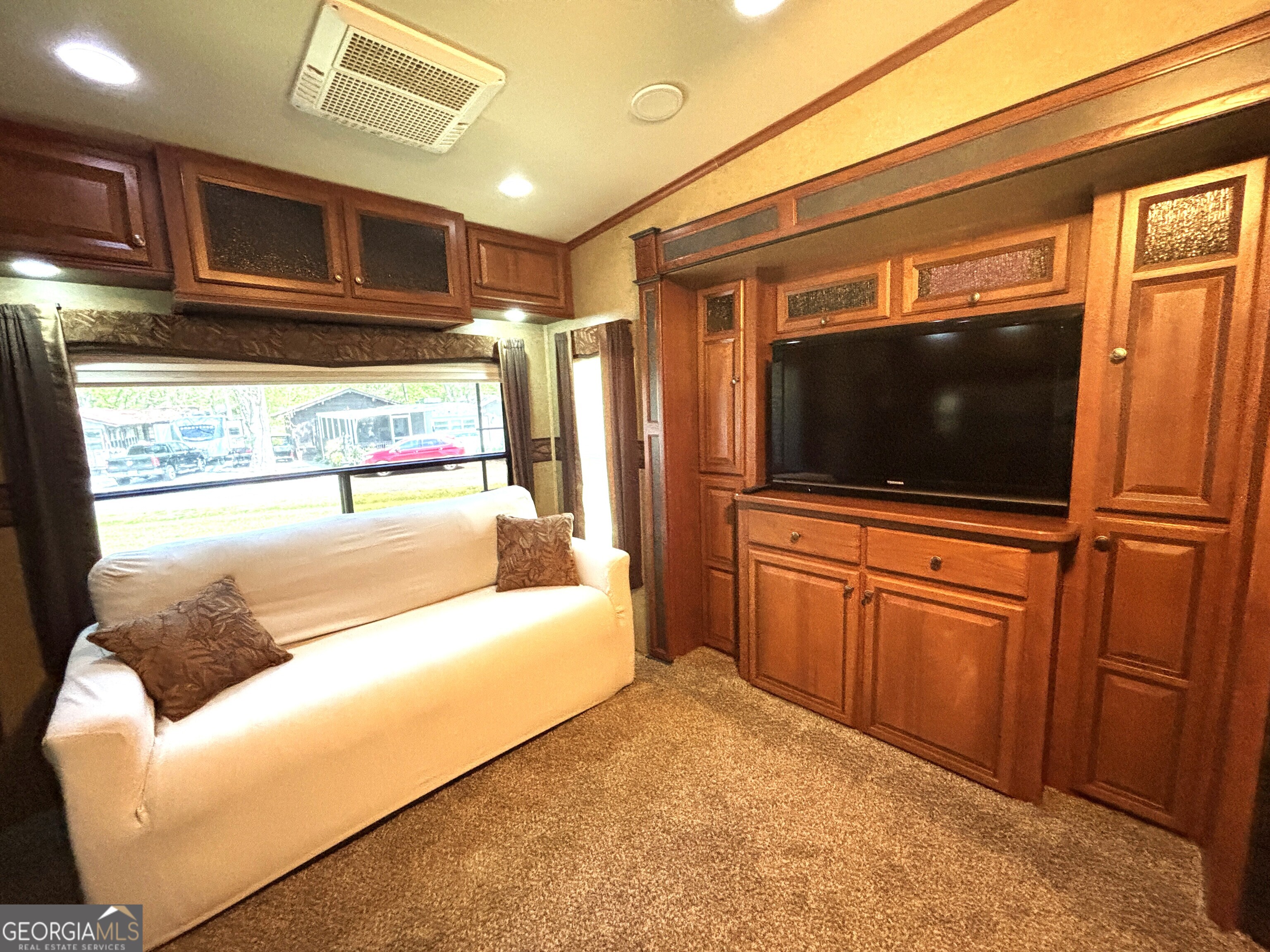 101 Bridge Loop Drive Cleveland, GA 30528 - Photo 24 of 93 a living room with stainless steel appliances furniture and a flat screen tv