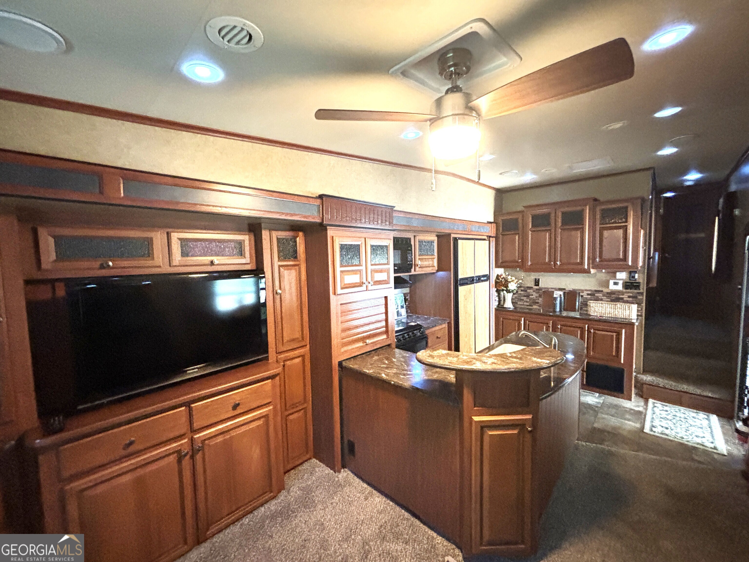 101 Bridge Loop Drive Cleveland, GA 30528 - Photo 28 of 93 a kitchen with stainless steel appliances granite countertop a sink a stove and a refrigerator