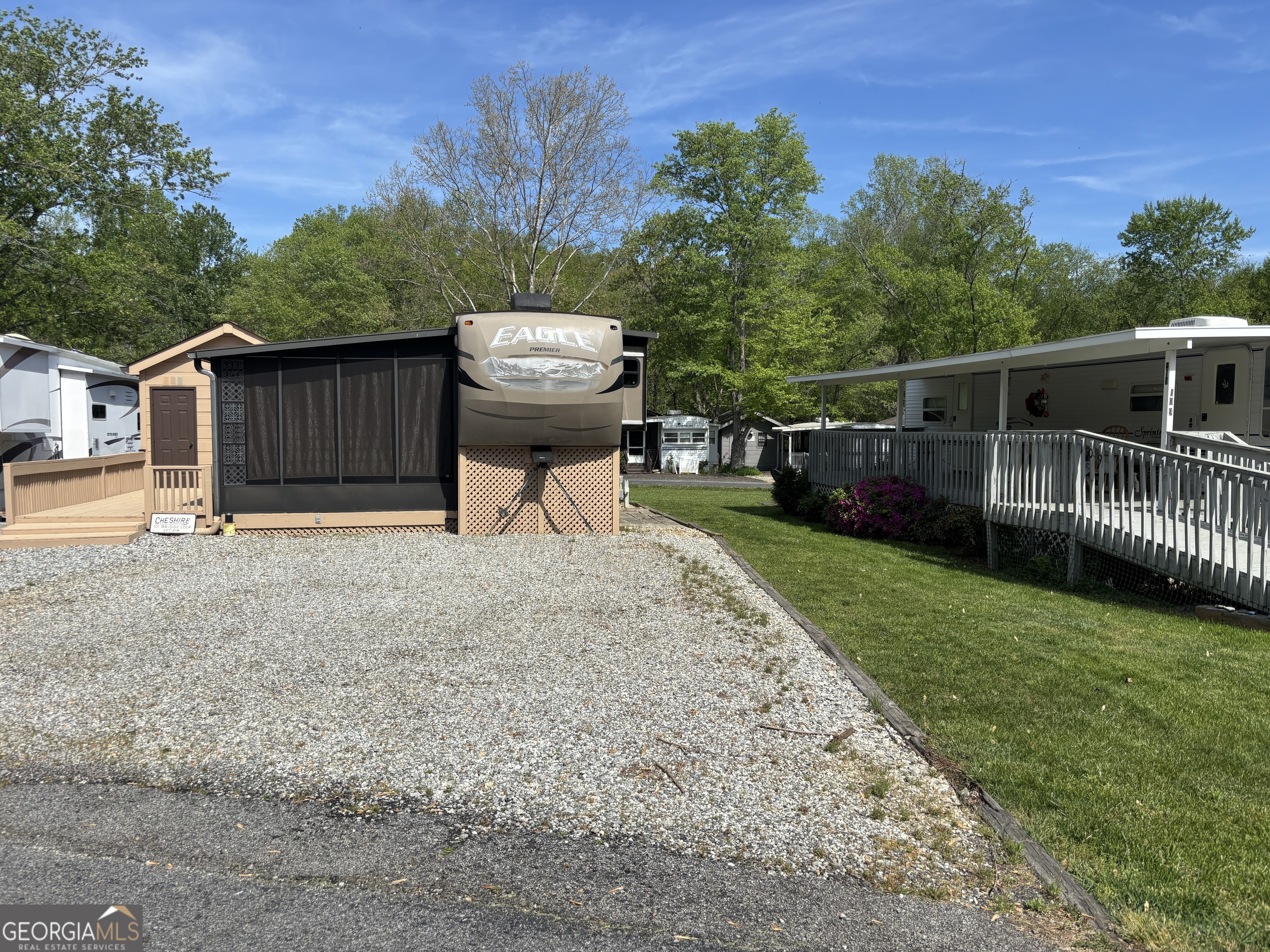 101 Bridge Loop Drive Cleveland, GA 30528 - Photo 3 of 93 a view of a backyard with couches plants and large trees