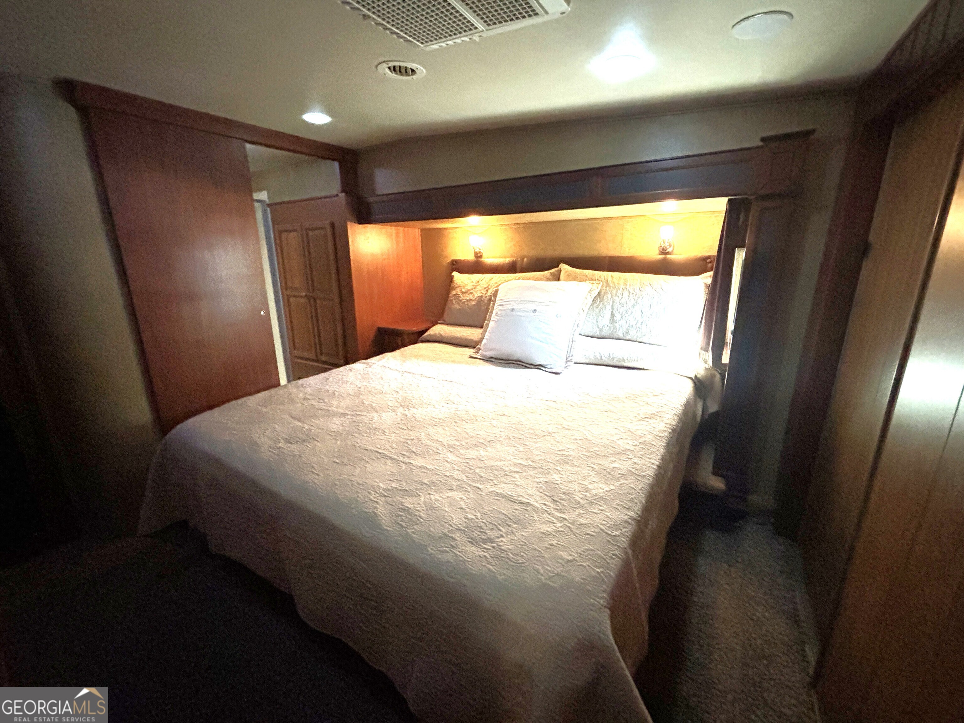 101 Bridge Loop Drive Cleveland, GA 30528 - Photo 39 of 93 a bed sitting in a bedroom next to a window