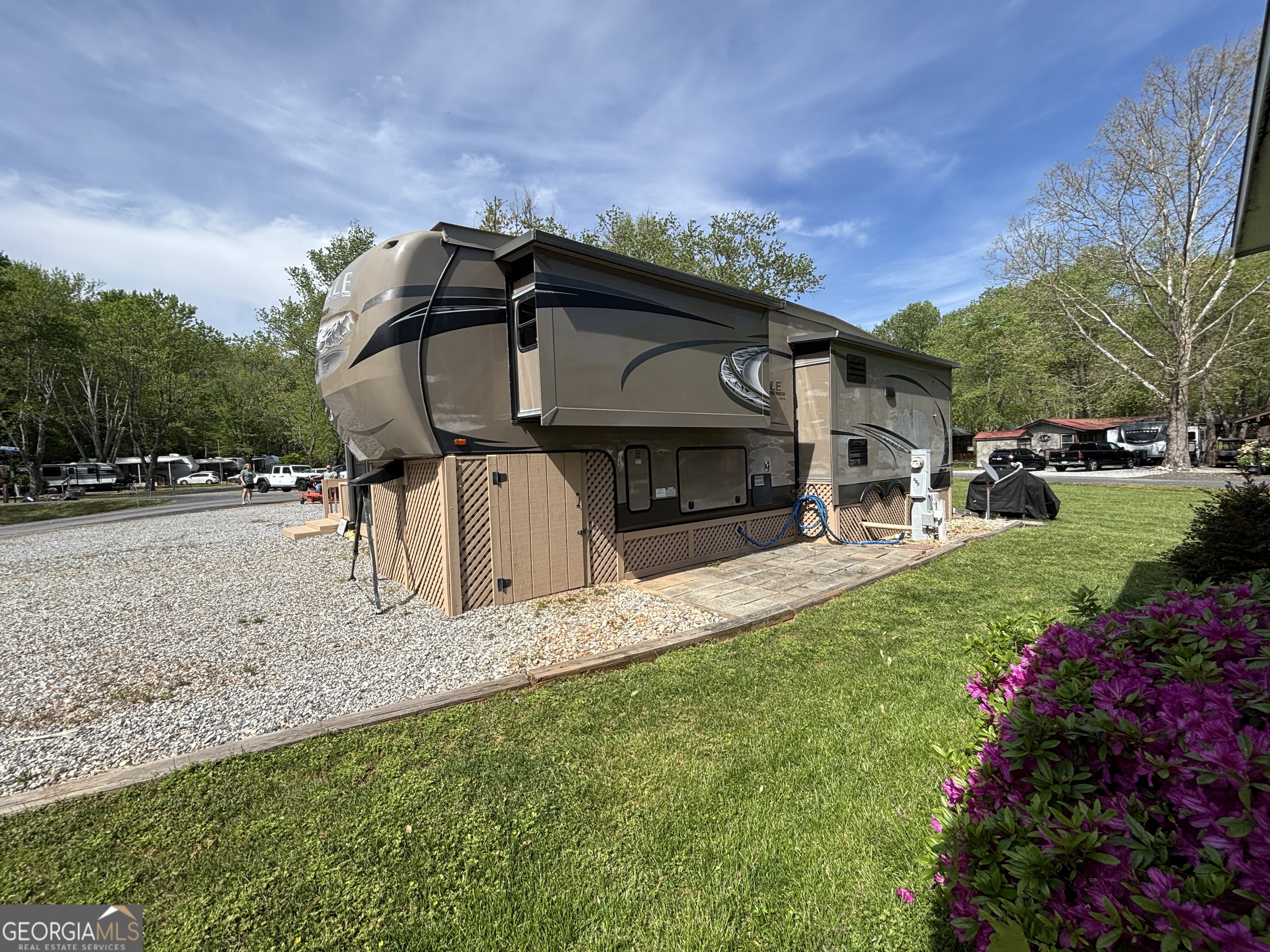 101 Bridge Loop Drive Cleveland, GA 30528 - Photo 5 of 93 a front view of a house with a yard and garage