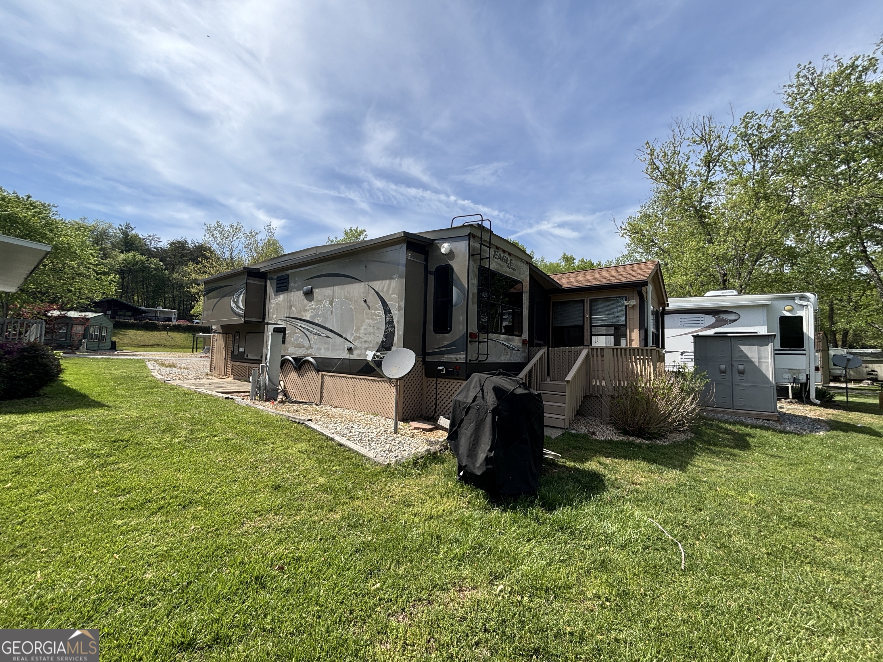 101 Bridge Loop Drive Cleveland, GA 30528 - Photo 6 of 93 a view of a house with backyard sitting area and garden