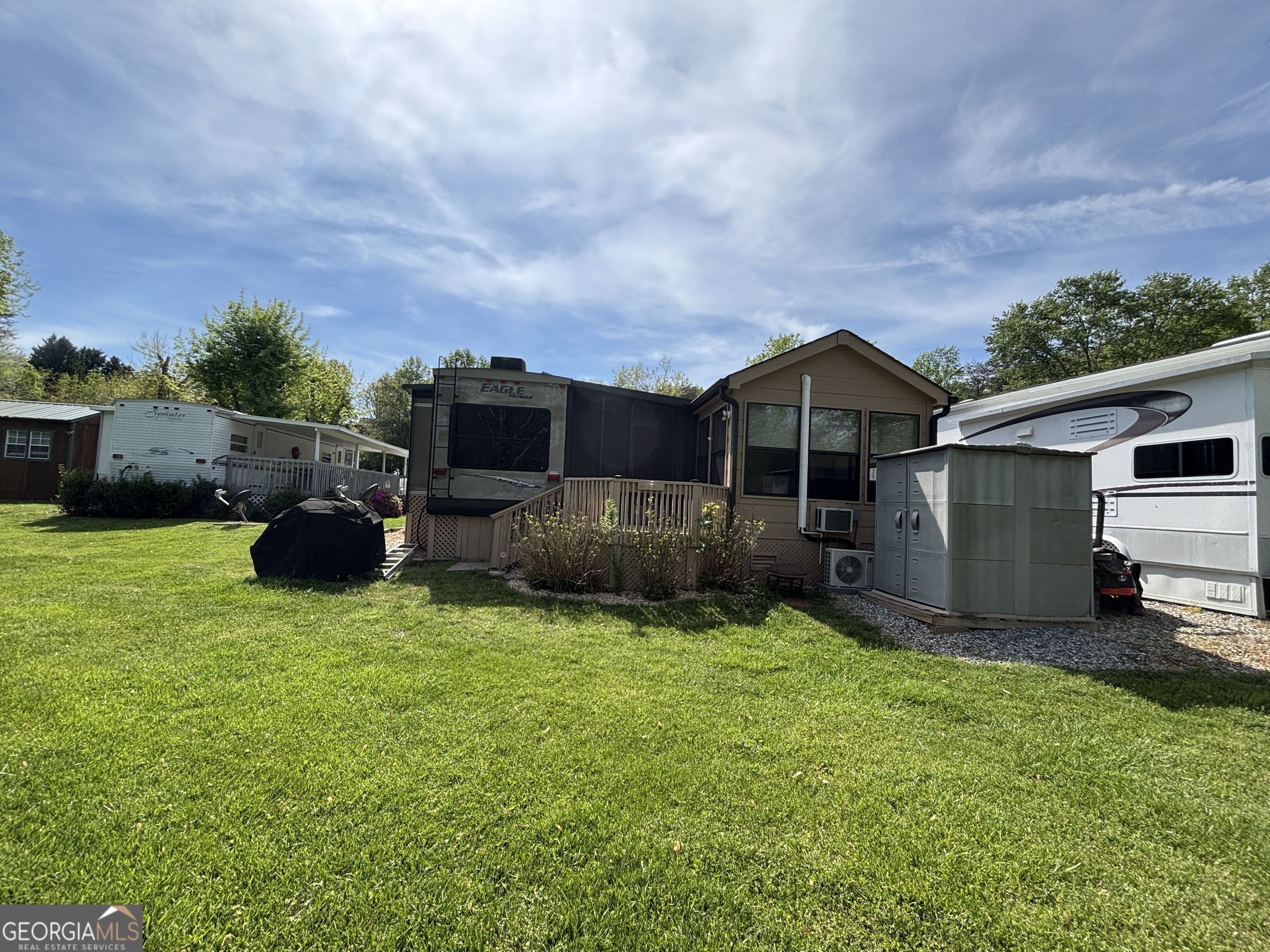 101 Bridge Loop Drive Cleveland, GA 30528 - Photo 68 of 93 a view of a house with backyard sitting area and garden