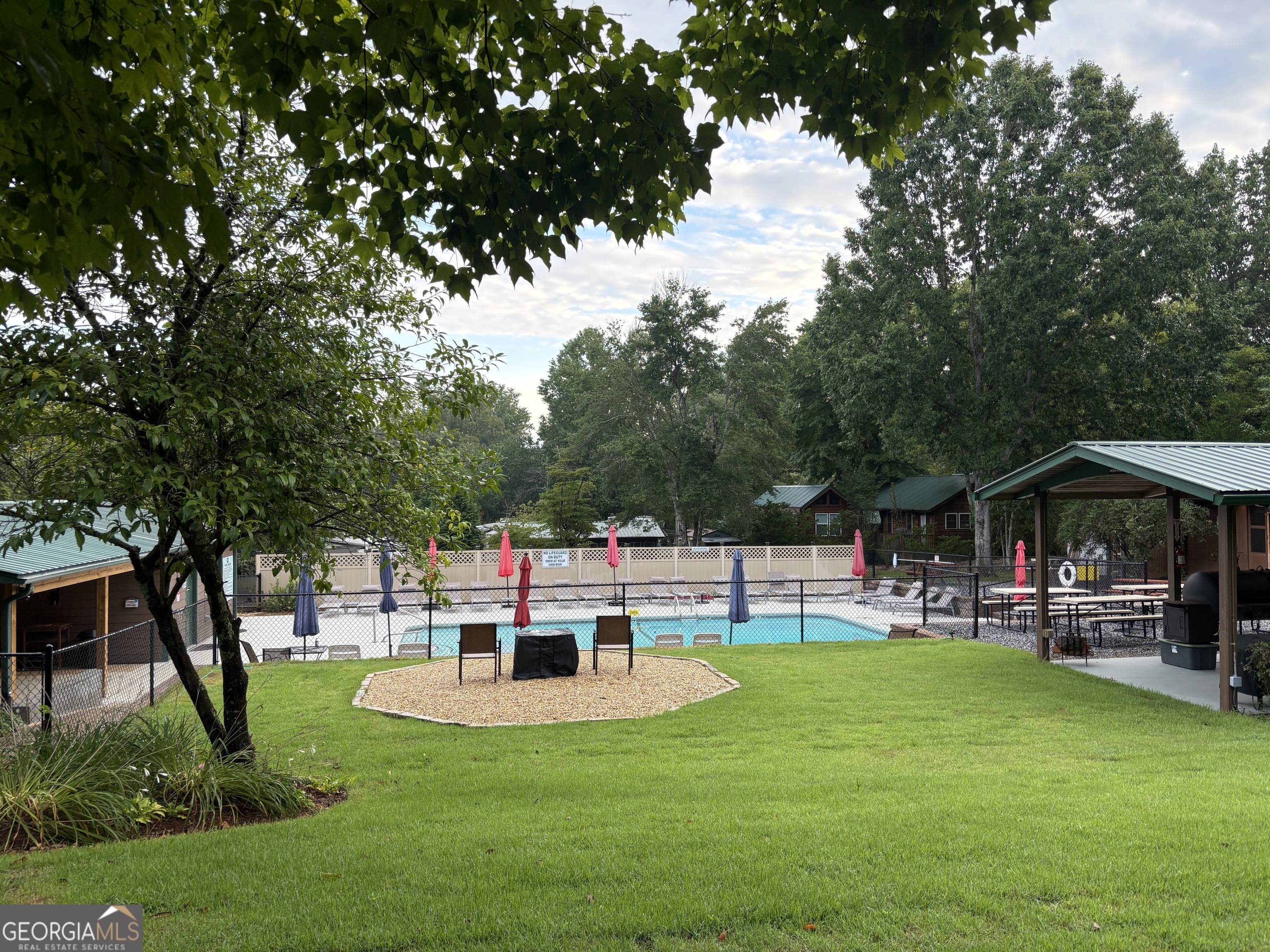 101 Bridge Loop Drive Cleveland, GA 30528 - Photo 75 of 93 a view of a chair and tables in the garden