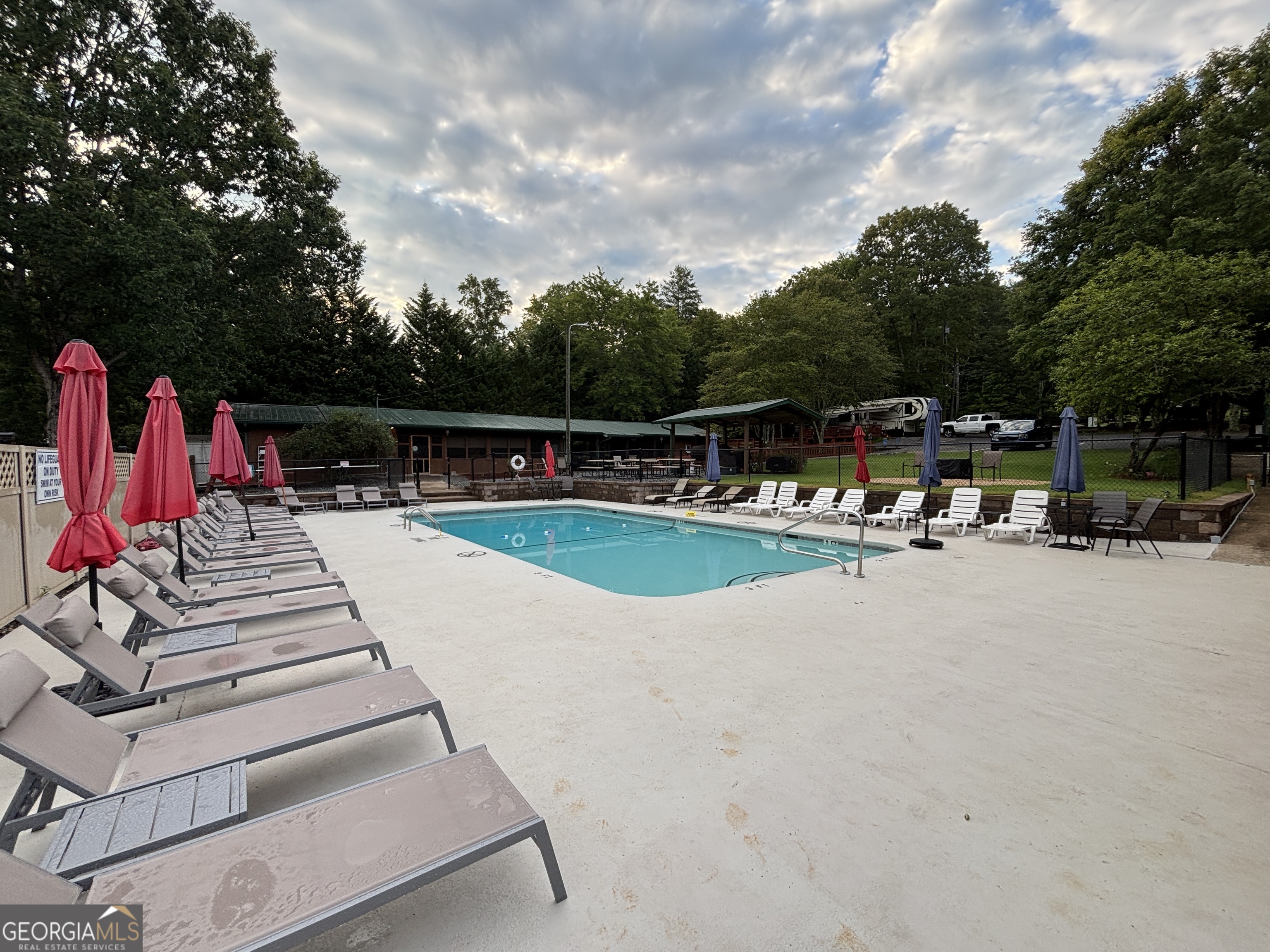 101 Bridge Loop Drive Cleveland, GA 30528 - Photo 79 of 93 a view of swimming pool with chairs and trees