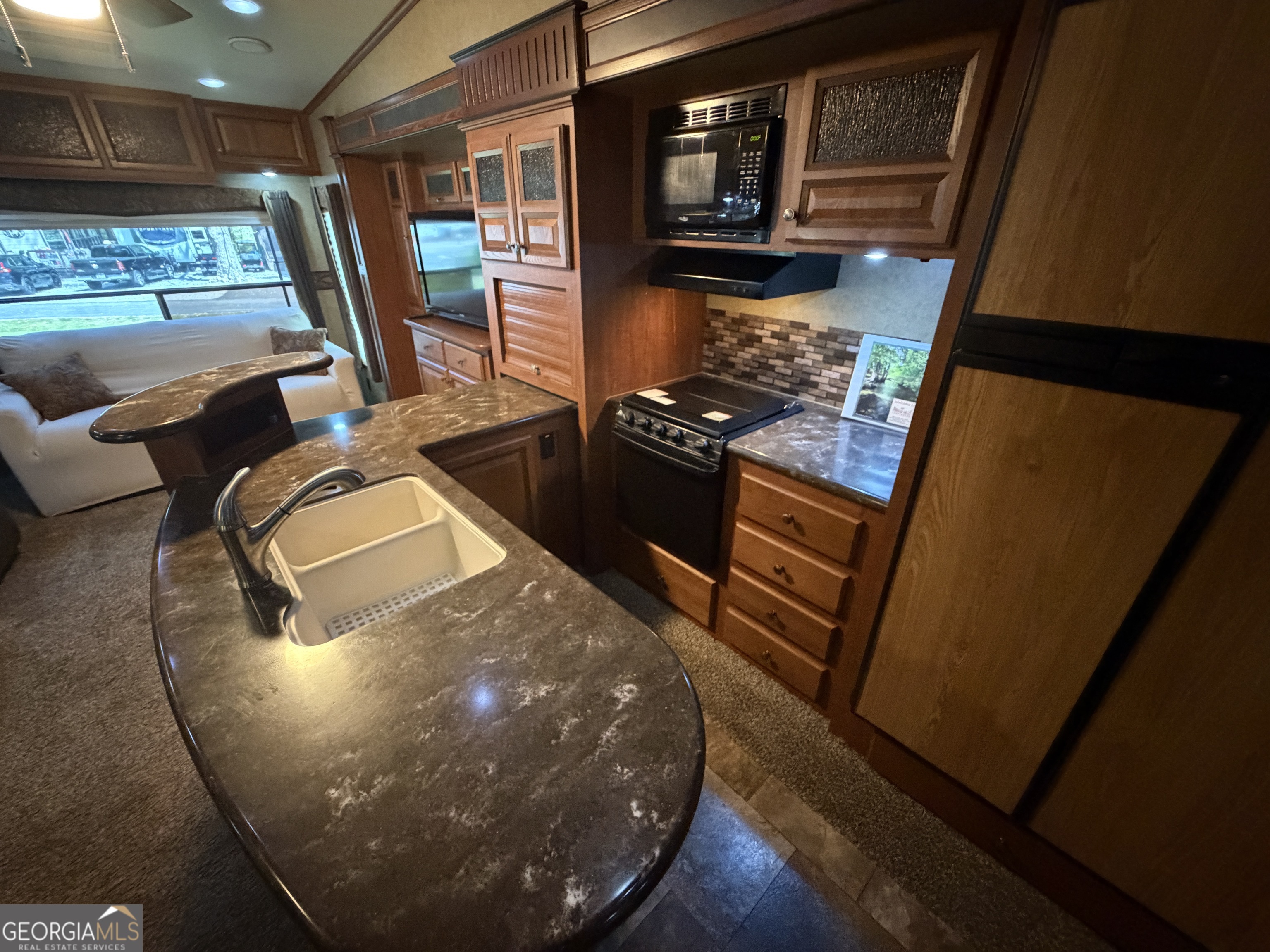 101 Bridge Loop Drive Cleveland, GA 30528 - Photo 10 of 93 a view of a living room with furniture and a floor to ceiling window