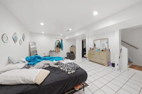 a bedroom with a large bed and a view of bedroom
