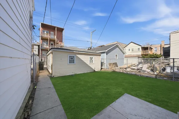 a view of a back yard of the house