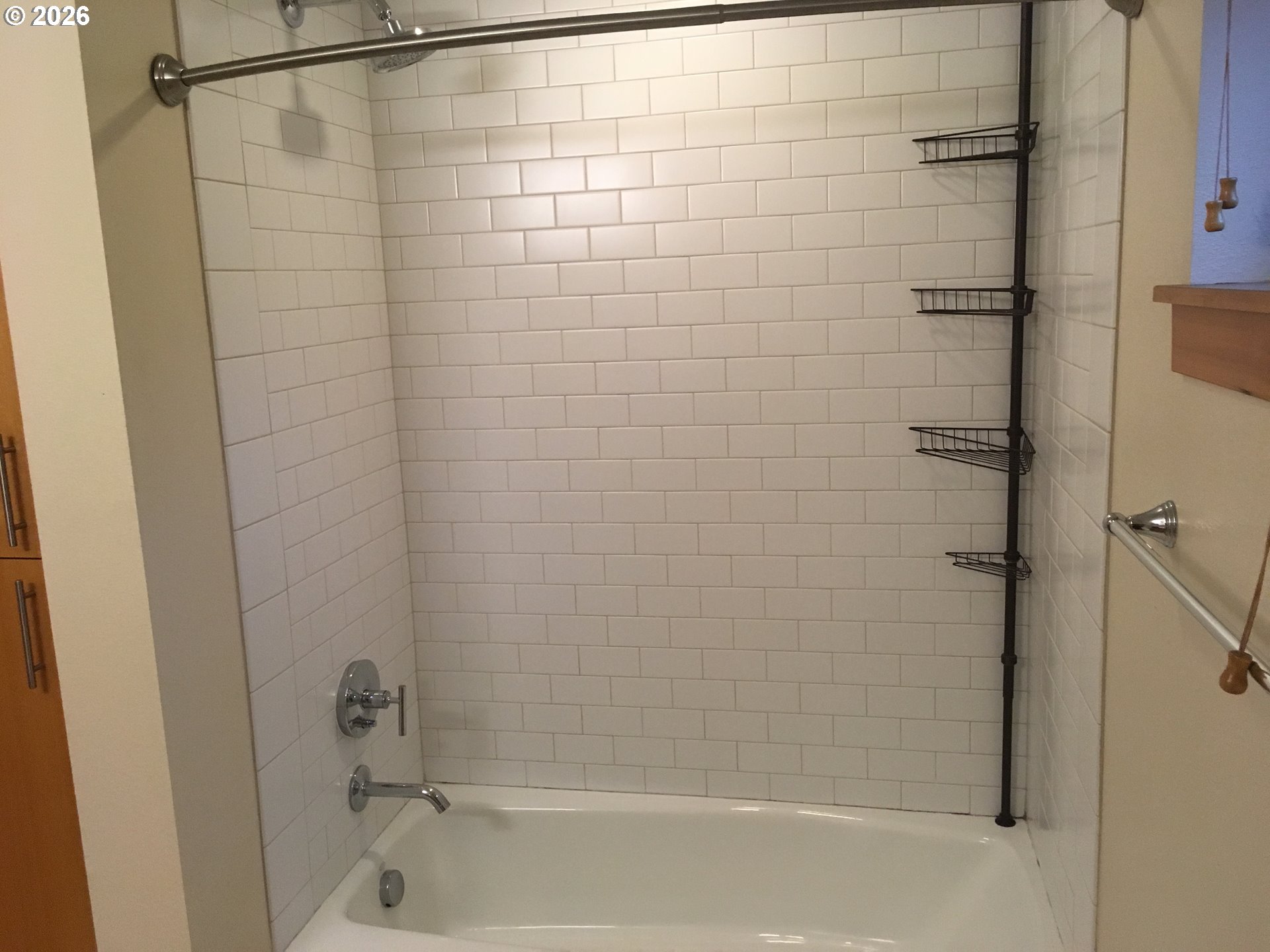 7910 Southwest 31st Avenue, Unit 306 Portland, OR 97219 - Photo 12 of 19 a bathroom with a shower and a bathtub