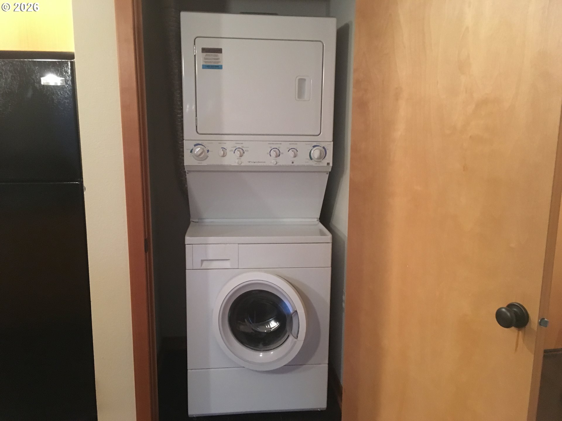 7910 Southwest 31st Avenue, Unit 306 Portland, OR 97219 - Photo 14 of 19 a utility room with dryer and washer