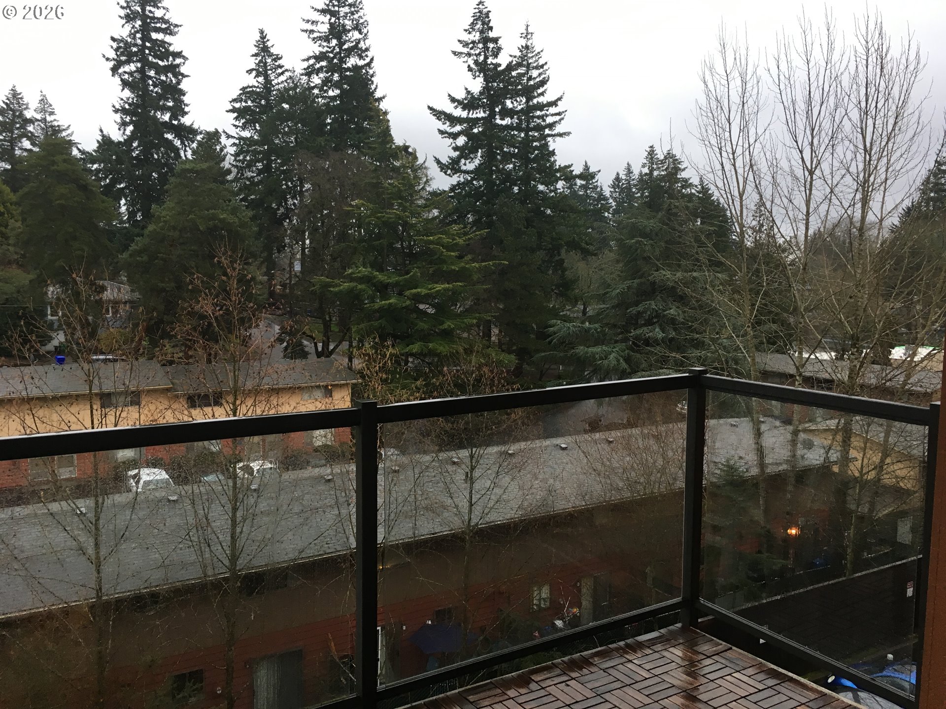 7910 Southwest 31st Avenue, Unit 306 Portland, OR 97219 - Photo 15 of 19 a view of city from a balcony