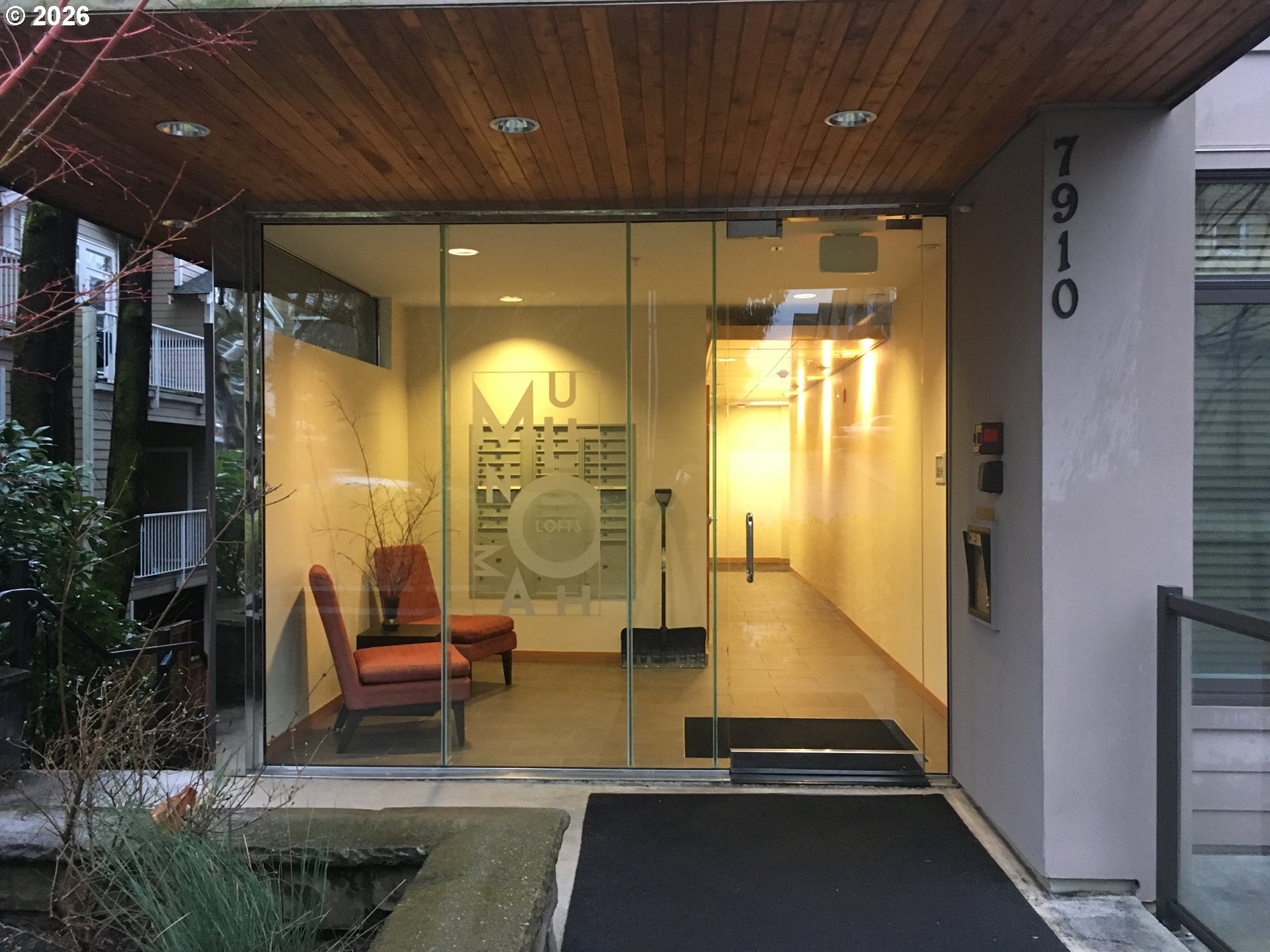 7910 Southwest 31st Avenue, Unit 306 Portland, OR 97219 - Photo 19 of 19 a lobby with furniture and floor to ceiling window